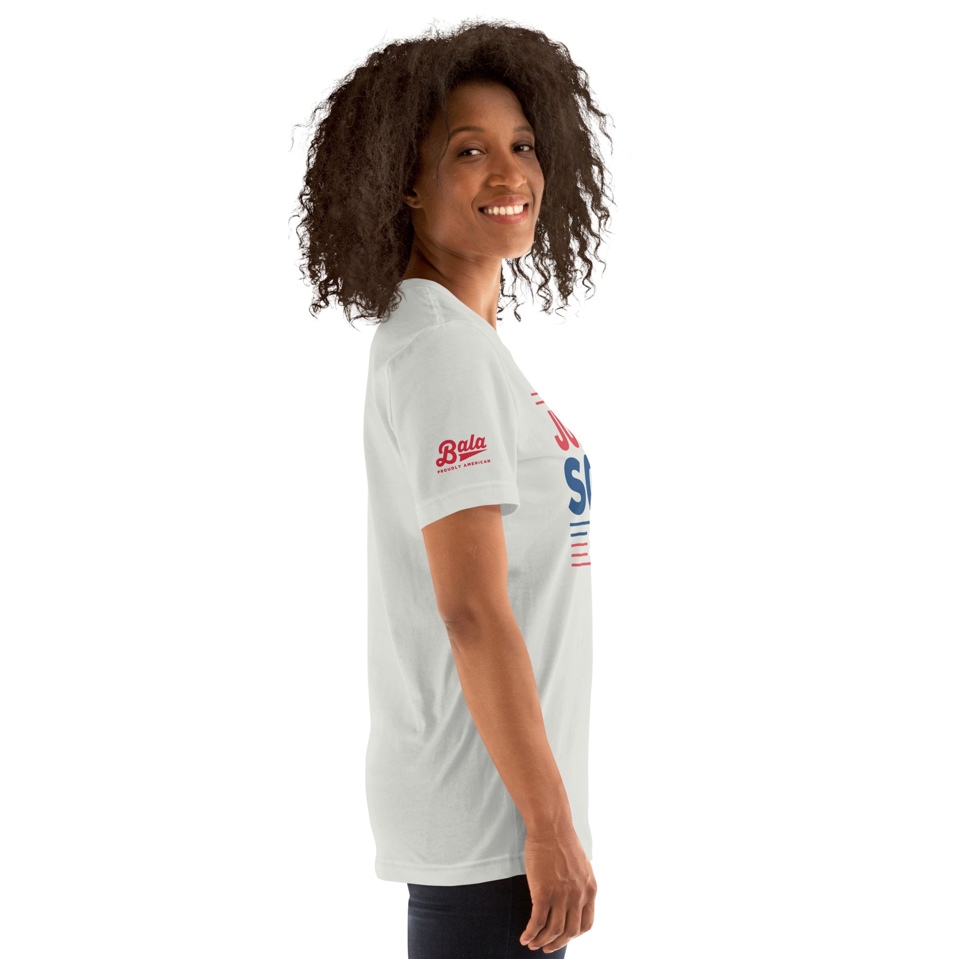 Woman wearing Judge Soto Election unisex baseball t-shirt in silver, side view, smiling