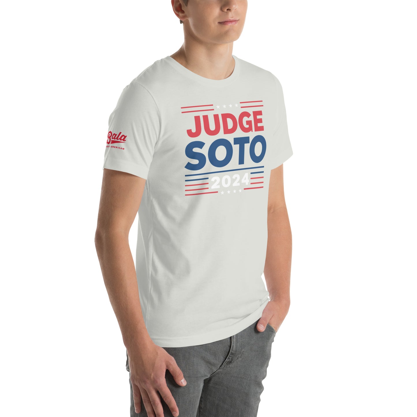 Model wearing a silver unisex baseball t-shirt with "Judge Soto 2024" printed in red and blue.