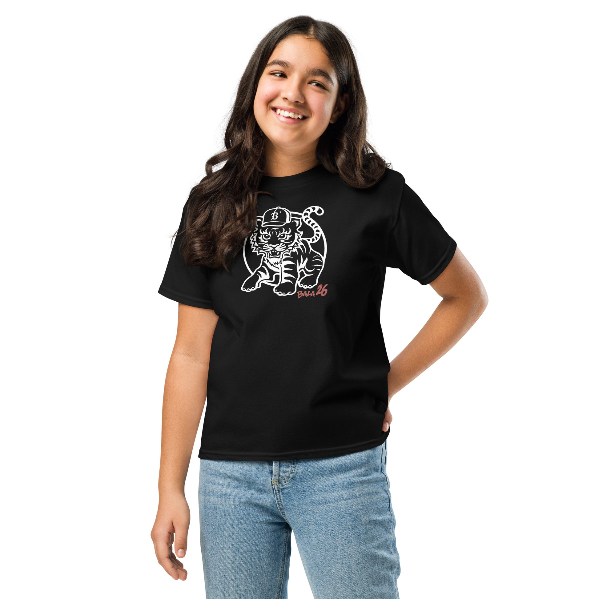 Smiling girl wearing a black Tiger 26 youth classic tee, featuring a baseball tiger graphic, versatile and comfortable for daily adventures.